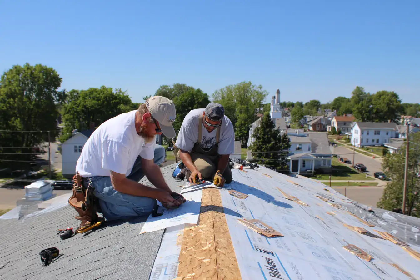 Professional roofing crew installing shingles on a residential home in Kendallville, Indiana